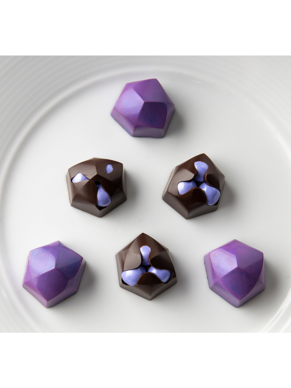 polycarbonate faceted chocolate mold, geometric chocolate mold, gemstone chocolate mould, diamond chocolate mold, polygon praline chocolate mold, jewel shaped chocolate mold, faceted bonbon mold, 3D geometric chocolate mold, angular chocolate mould, modern praline mold, decorative chocolate mold, professional polycarbonate chocolate mold, filled chocolate mold, artisan chocolate mold, confectionery chocolate mold, chocolate casting mold, reusable chocolate mold, rigid chocolate mould