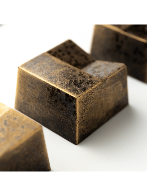 polycarbonate geometric chocolate mold, faceted praline chocolate mold, triangular pattern chocolate mould, recessed geometric chocolate mold, square praline chocolate mold, angular chocolate mould, modern bonbon mold, abstract chocolate mold, 3D geometric chocolate mold, diamond cut chocolate mold, special design chocolate mold, professional polycarbonate chocolate mold, filled chocolate mold, artisan chocolate mold, confectionery chocolate mold, chocolate casting mold, reusable chocolate mold, rigid choco